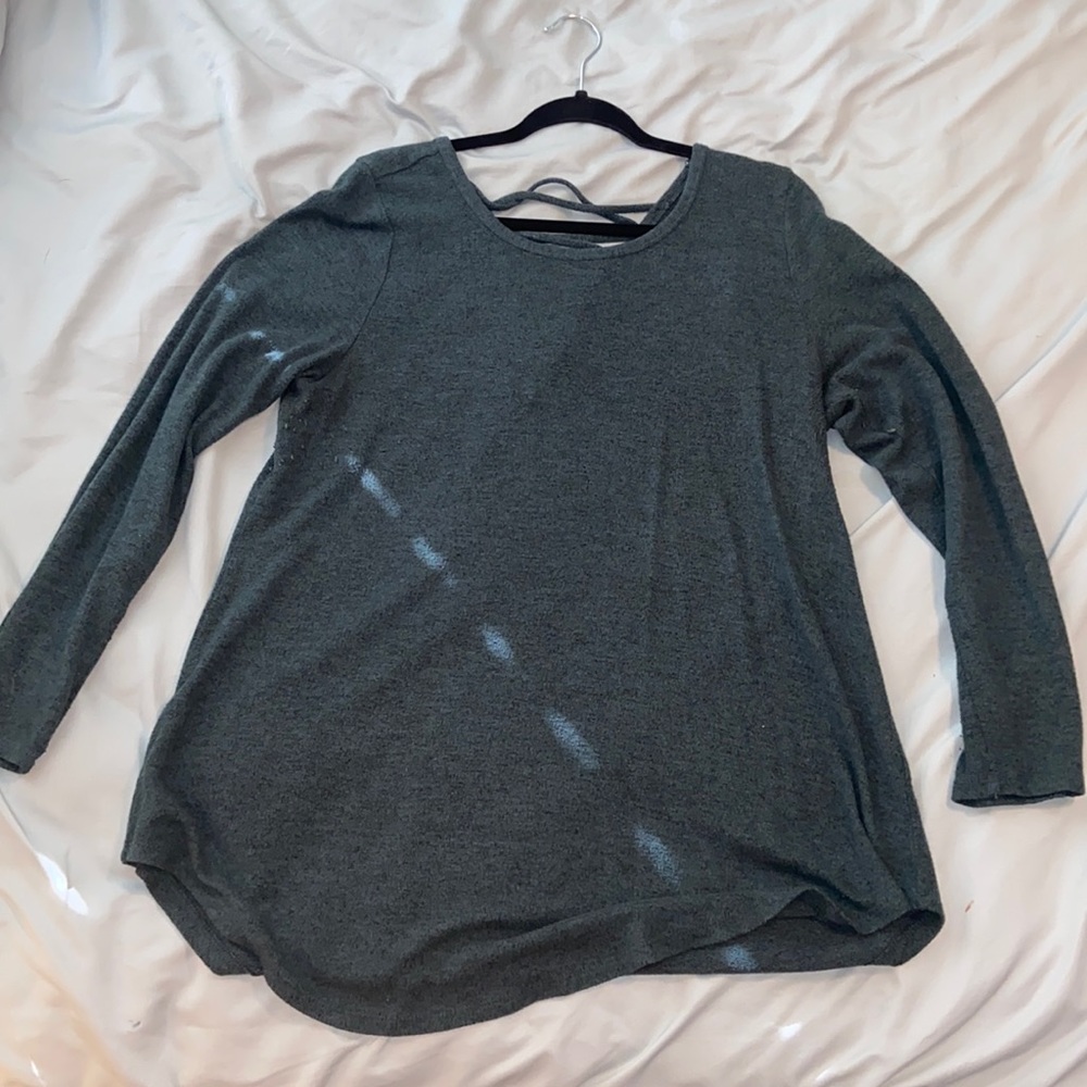 Torrid 1. Green long sleeve top, criss cross detail on the back.